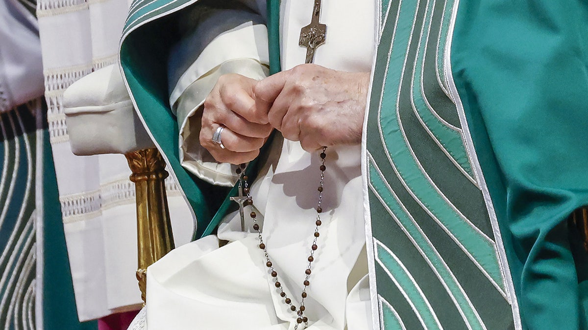 Pope Francis with a rosary