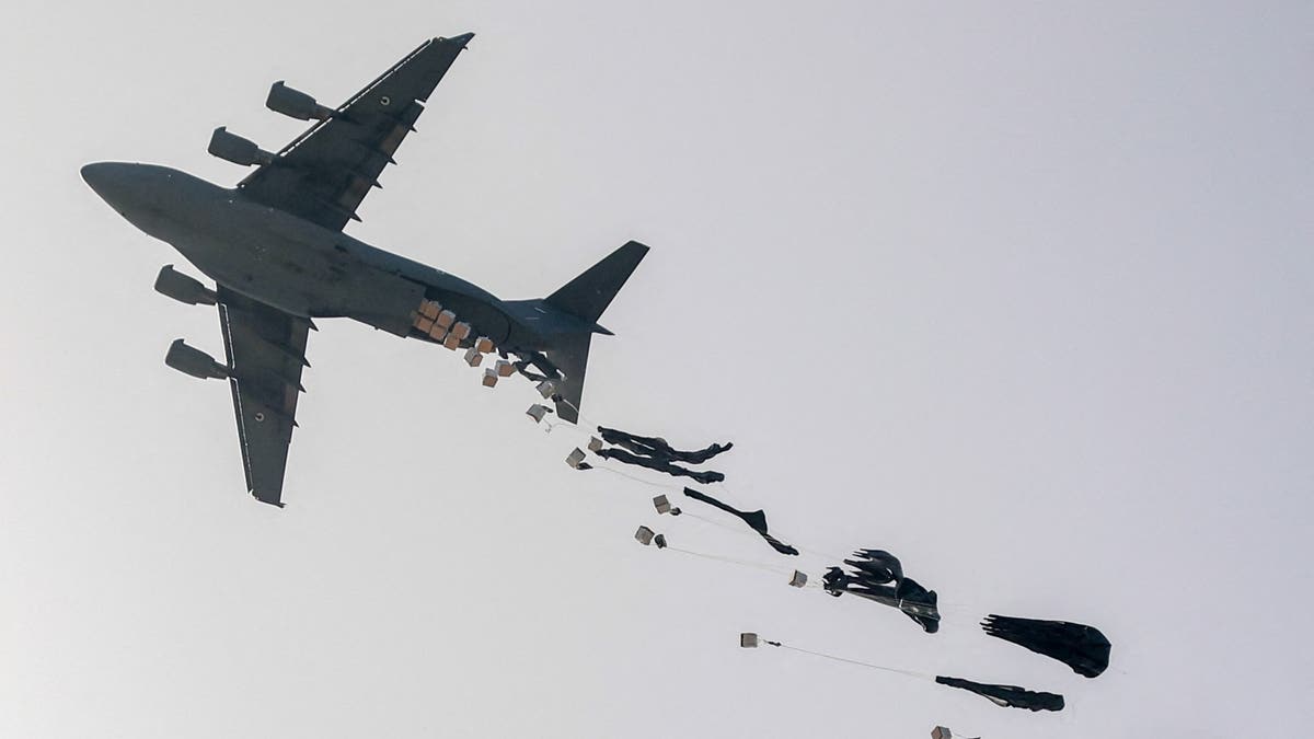 UAE Air Force C-17 Globemaster III military transport aircraft drops aid packages on the northern Gaza Strip on April 23, 2024, amid the ongoing conflict in the Palestinian territory between Israel and the militant group Hamas.