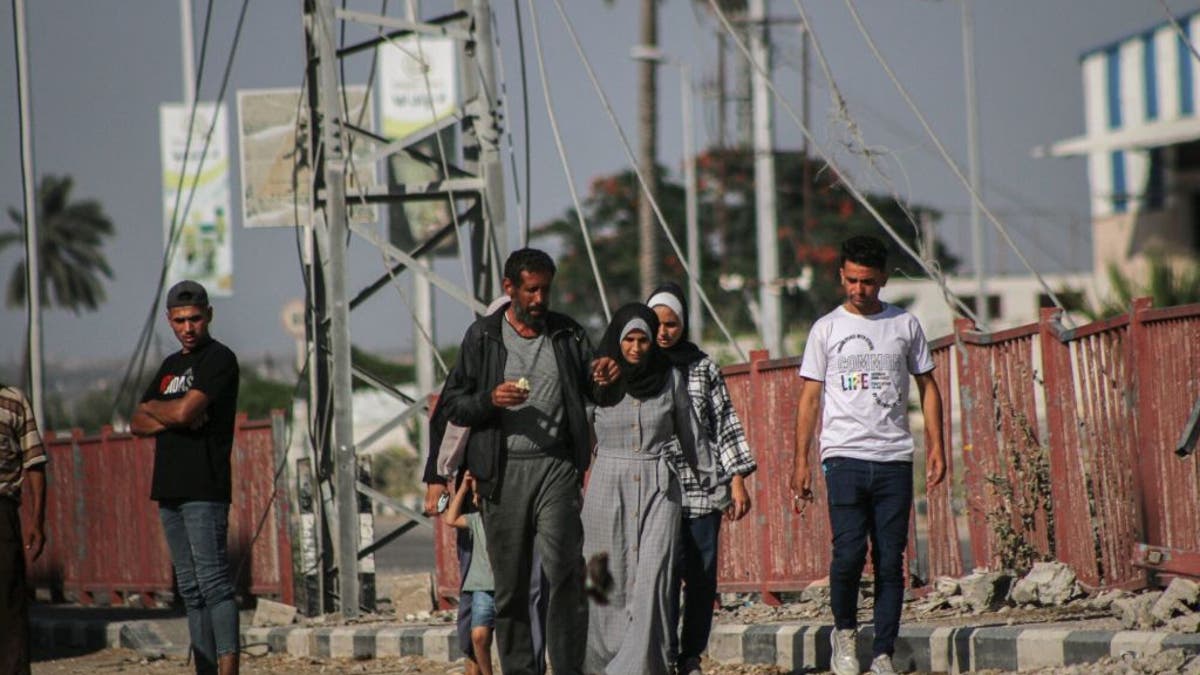 Displaced Palestinians flee Gaza City through an Israeli army corridor in Netzarim to Salah al-Din Street in central Gaza, on Wednesday, July 10, 2024.