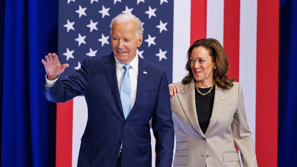 Joe Biden and Kamala Harris with US flag behind them.