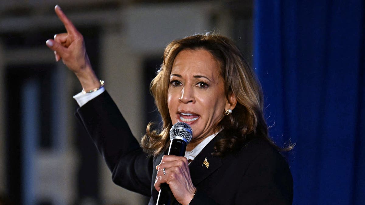 Harris successful  Pennsylvania with microphone successful  hand