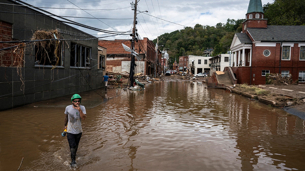 Man wades through Helene Waters in North Carolina