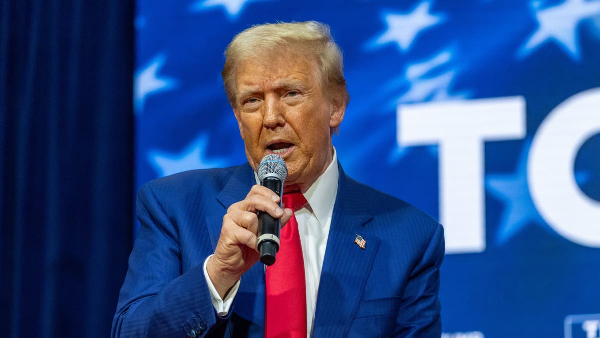 Trump speaks into a microphone at a town hall in Pennsylvania