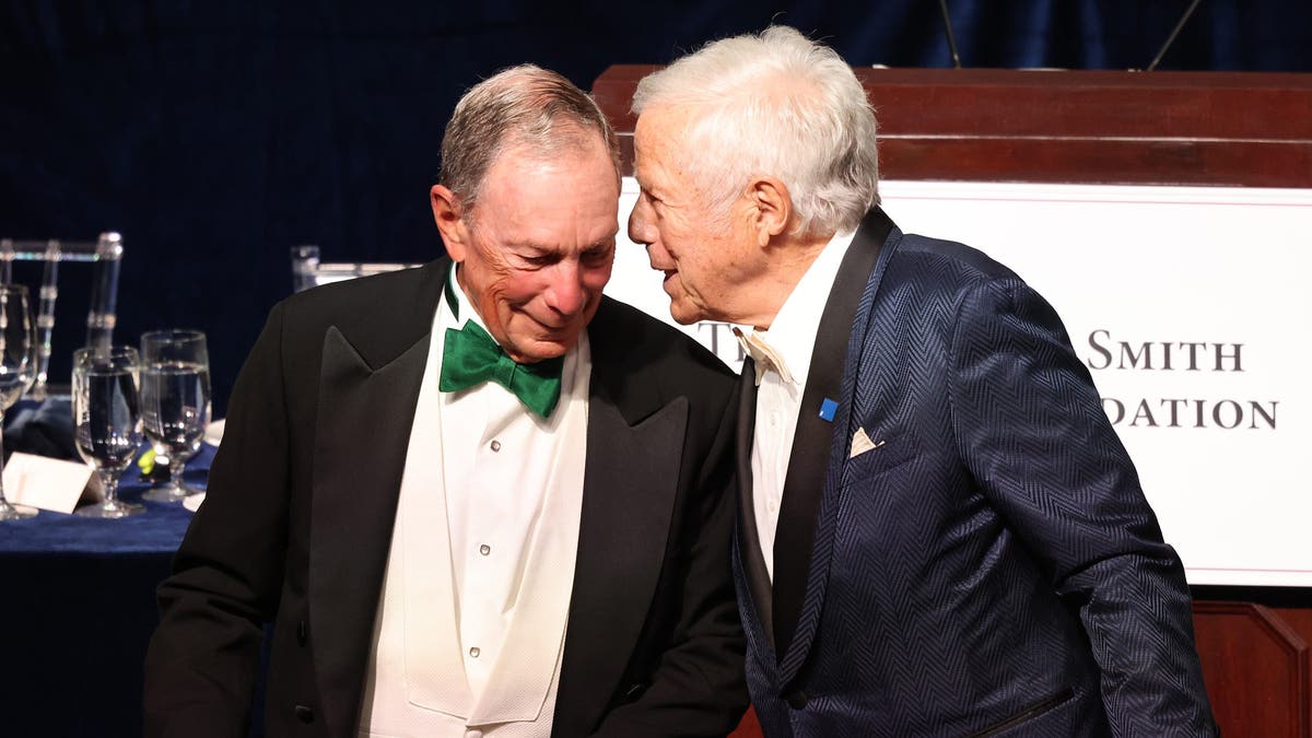 Mayor Mike Bloomberg, left, and New England Patriots owner Robert Kraft chat during the Alfred E. Smith Foundation Annual Dinner at the New York Hilton Midtown on October 17, 2024 in New York City.