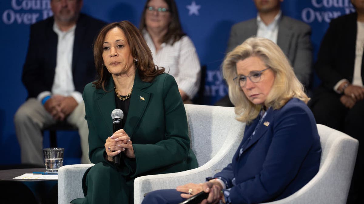 Kamala Harris, left, with Liz Cheney, right, at City Hall