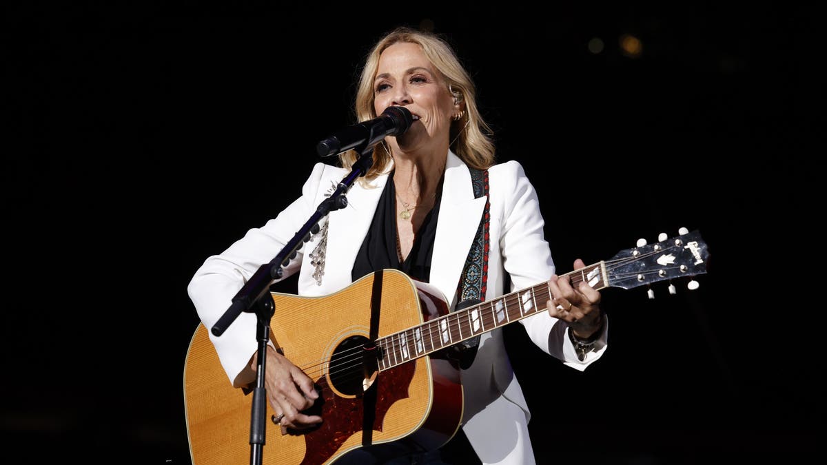 sheryl crow performing at benefit concert