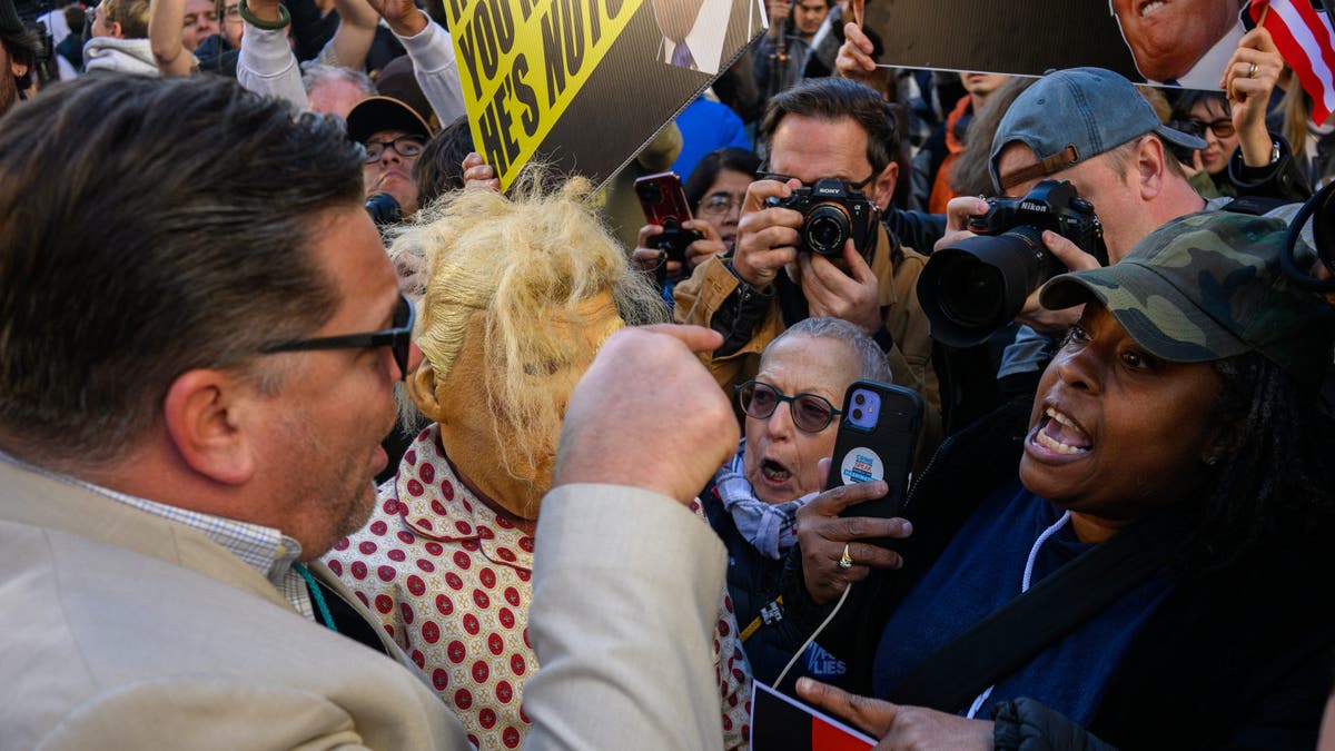 Supporters of former President Trump argue with anti-Trump demonstrators outside during a campaign rally at Madison Square Garden on Oct. 27, 2024, in New York City. (Alexi Rosenfeld/Getty Images)