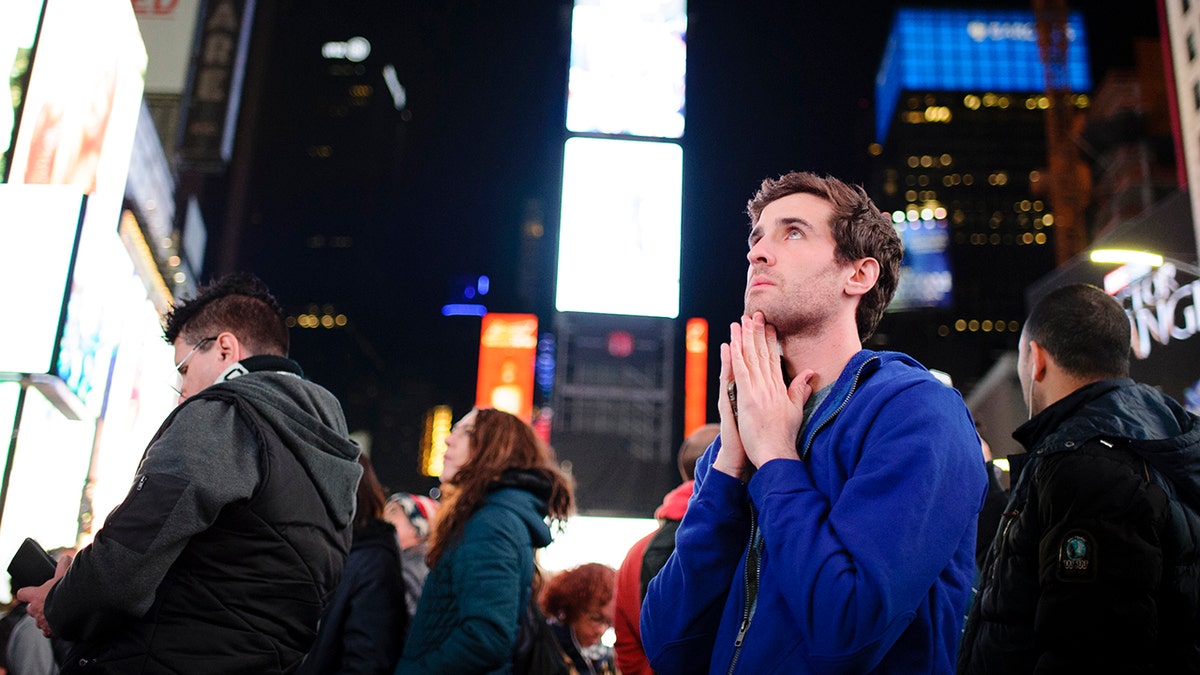 man watches election results in times square