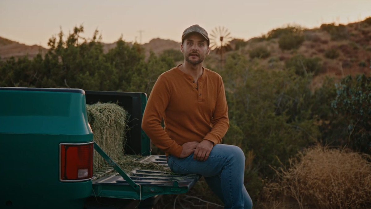 A man speaks in an accompanying video by Kamala Harris