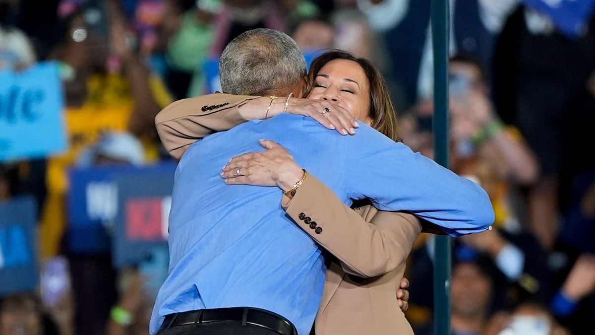 Harris hugs Obama astatine  rally