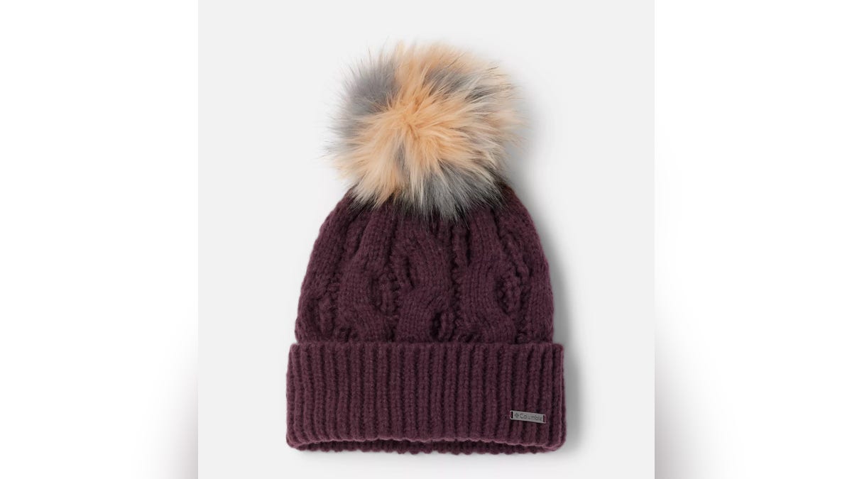 Pom pom beanies are a classical look for winter.