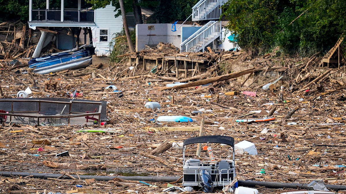 Debris is strewn on the lake in the aftermath of Hurricane Helene, Wednesday, Oct. 2, 2024, in Lake Lure, North Carolina.