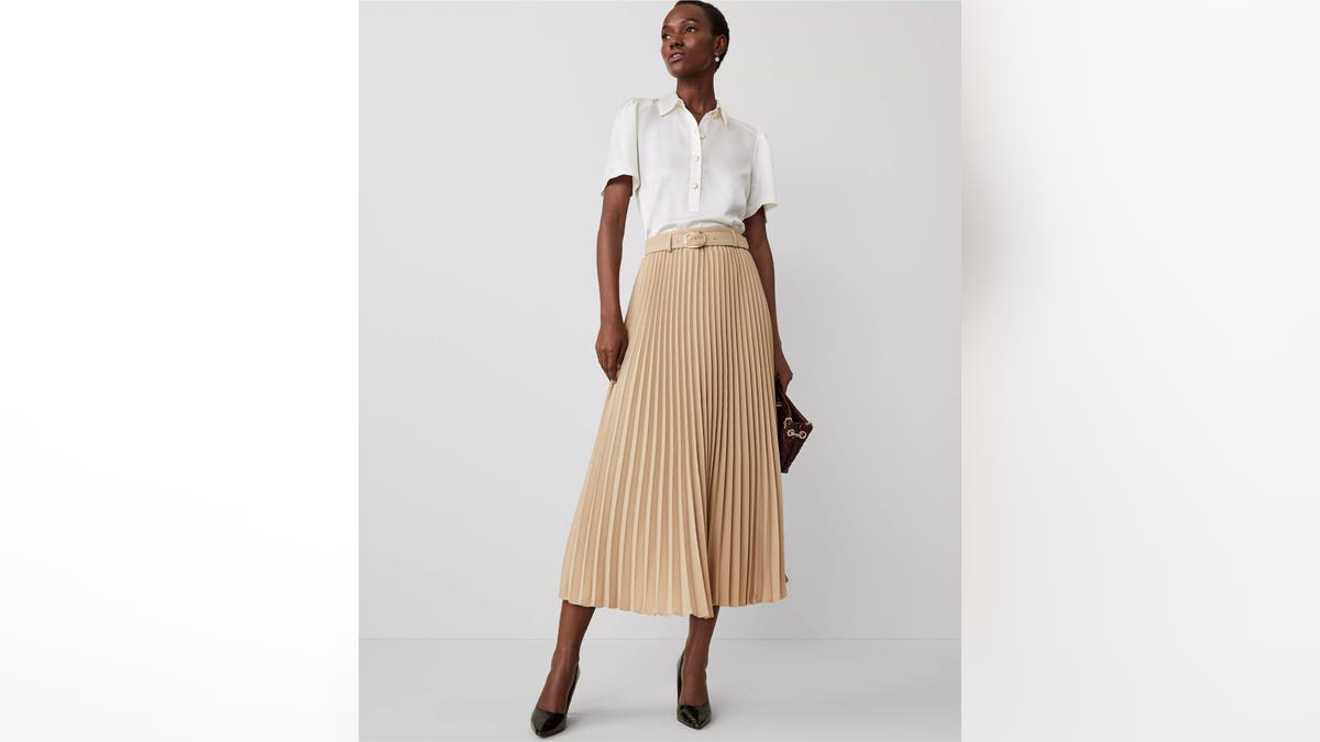 A pleated agelong  skirt is an elegant mode   to big   guests.