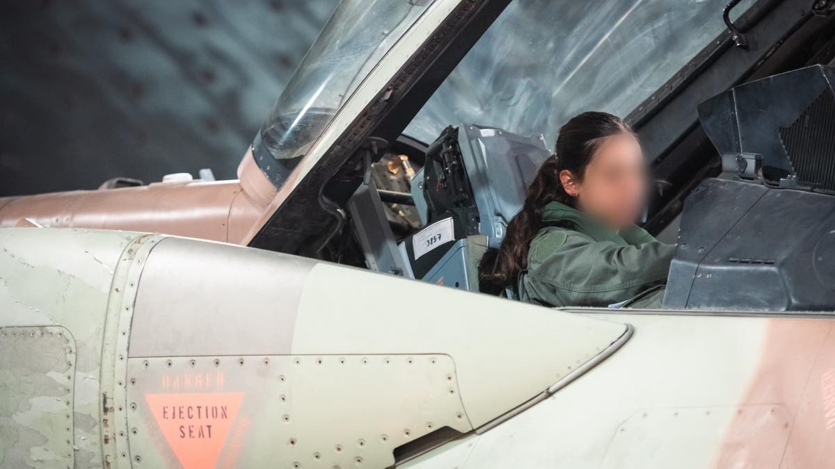 An Israel Defense Forces pilot in her plane as part of the "days of regret" mission against Iran.