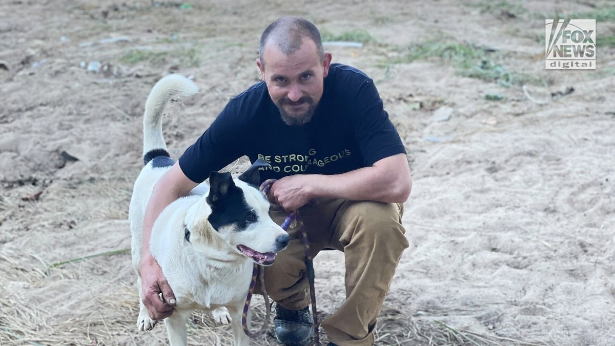 Kris Weil poses with her dog