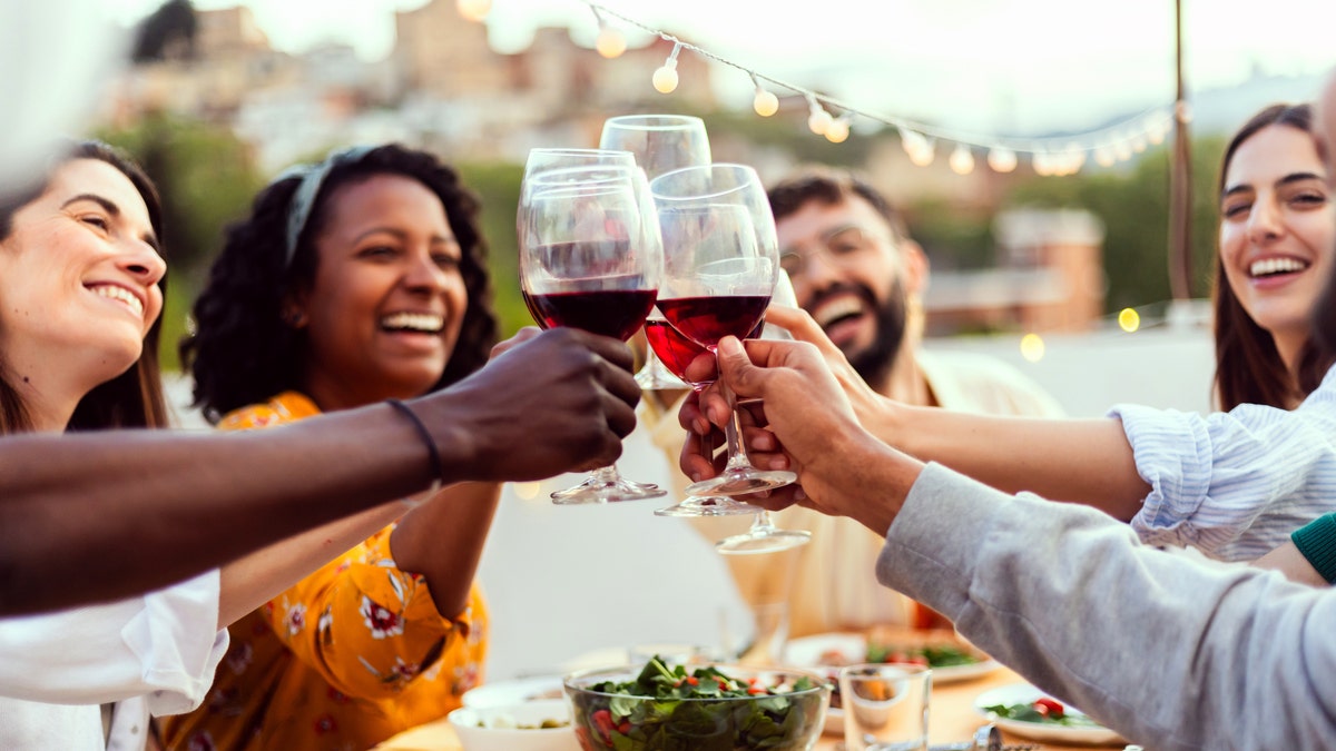 people drinking at dinner