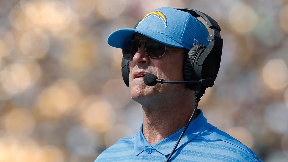 Jim Harbaugh looks on during an NFL game