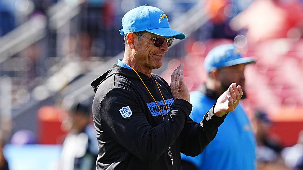 Chargers' Jim Harbaugh suddenly leaves the game due to a mysterious illness, returning minutes later