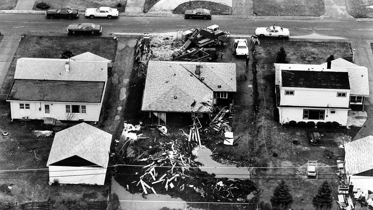 Black and white aerial view of John Wayne Gacy's destroyed home