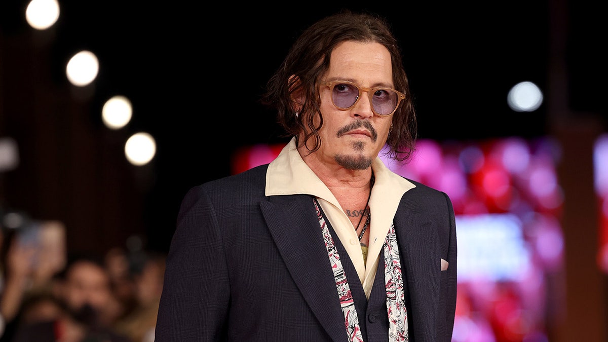 Johnny Depp posing on the red carpet