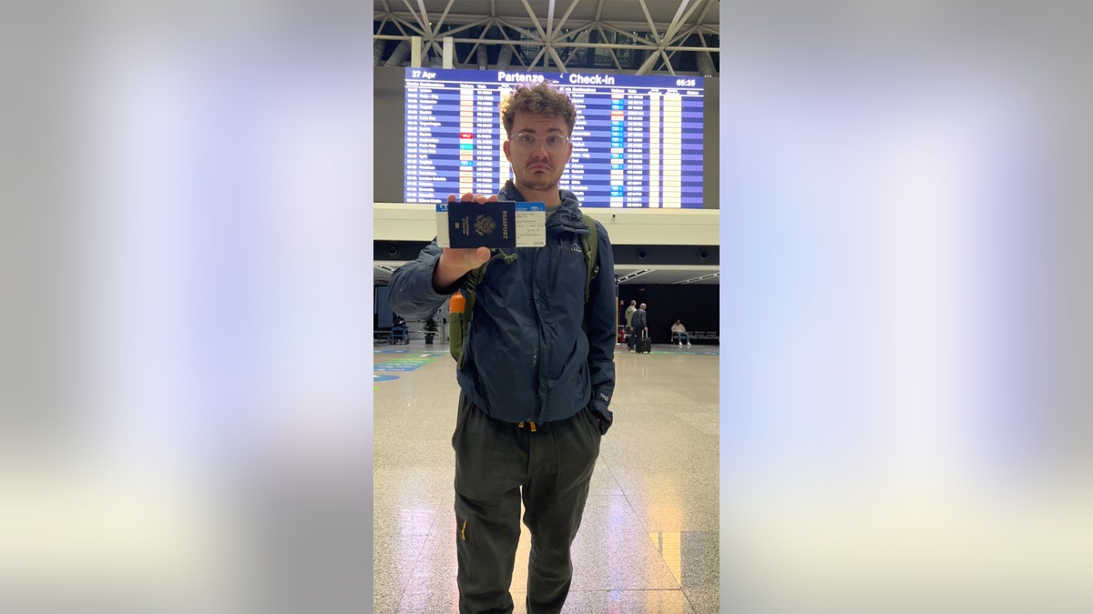 JT with boarding pass