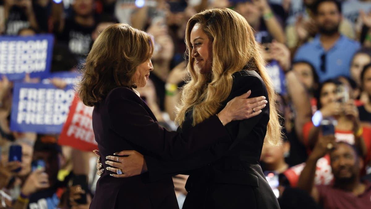 Musical artist Beyoncé (right) and Democratic presidential candidate Vice President Kamala Harris (left) hug on stage during a campaign event Friday, Oct. 25, 2024, in Houston. (AP Photo/Annie Mulligan)