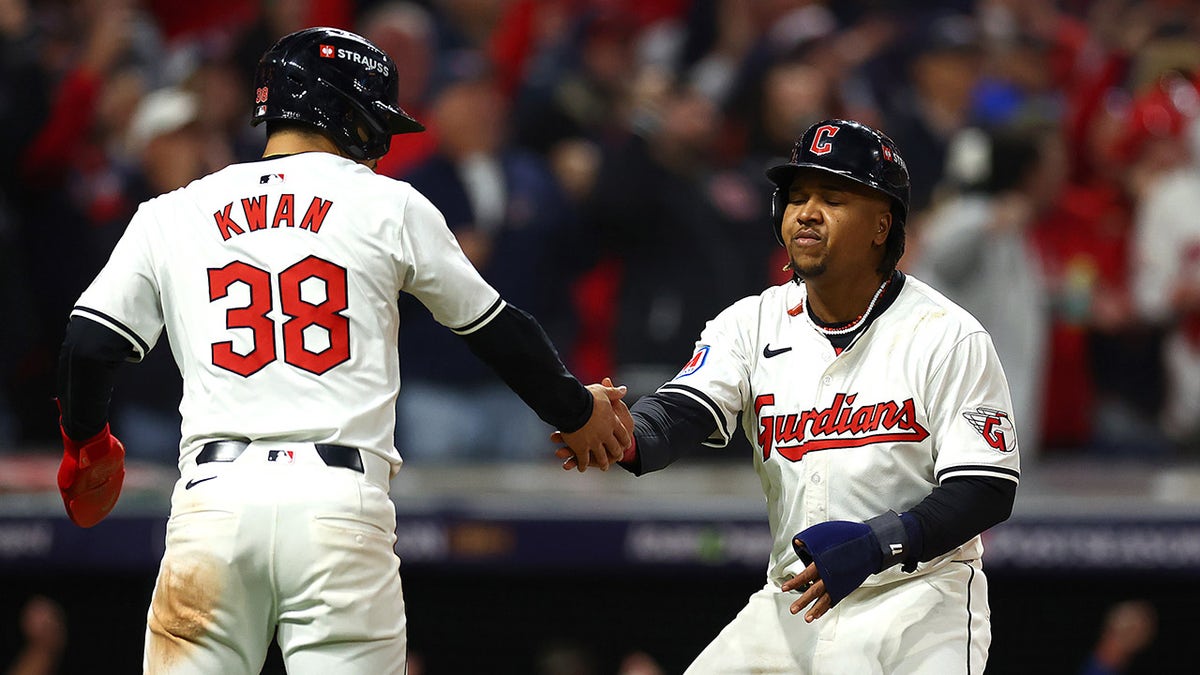 Jose Ramirez and Steven Kwan celebrating during a baseball game at Progressive Field