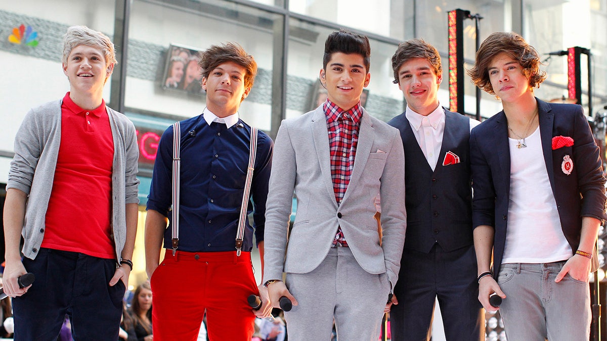 Members of British-Irish band One Direction pose after performing on NBC's "Today" show