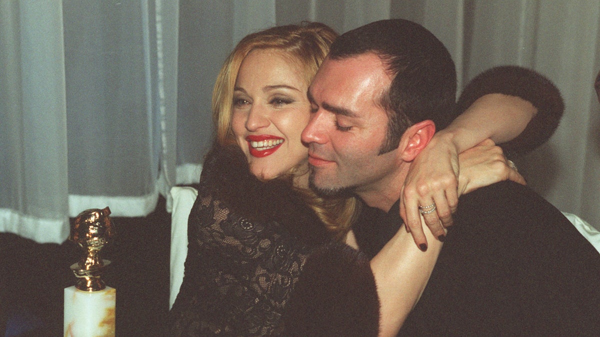 Madonna hugs her brother