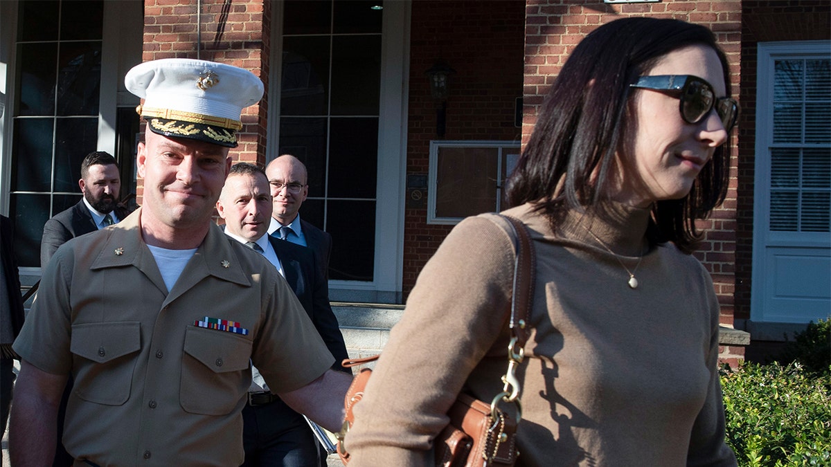 Marine Maj. Mast walking retired  of tribunal  with his wife.