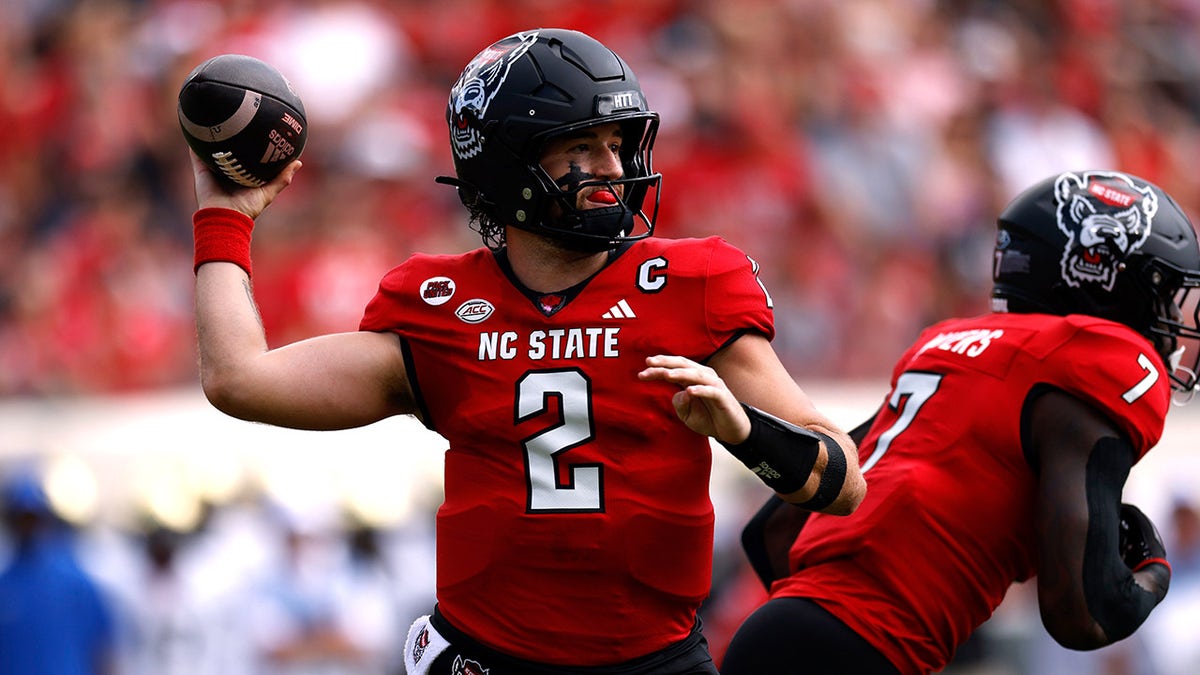 NC State quarterback Grayson McCall carted off the field after scary hit sends helmet flying