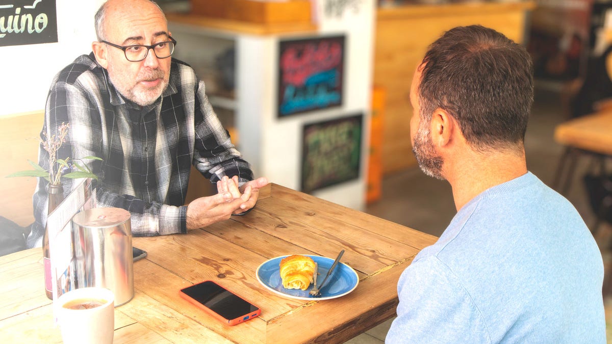 Men talking at coffee shop