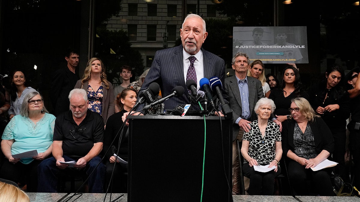 Attorney Mark Geragos speaks to members of the Menendez family during a press conference