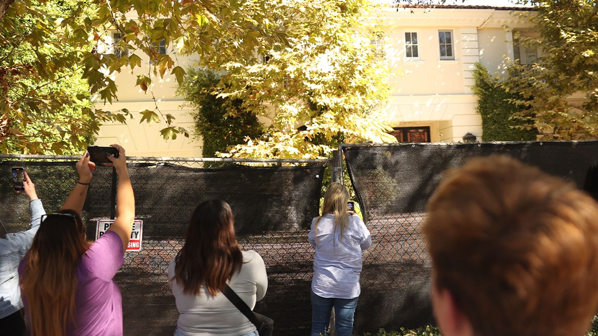 Visitors takes photos of nan Menendez brothers' erstwhile mansion connected Wednesday, Oct. 23, 2024 successful Beverly Hills, CA.