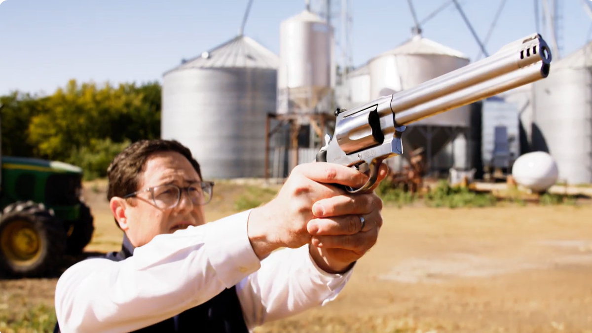 Rep. Mike Flood holds a gun