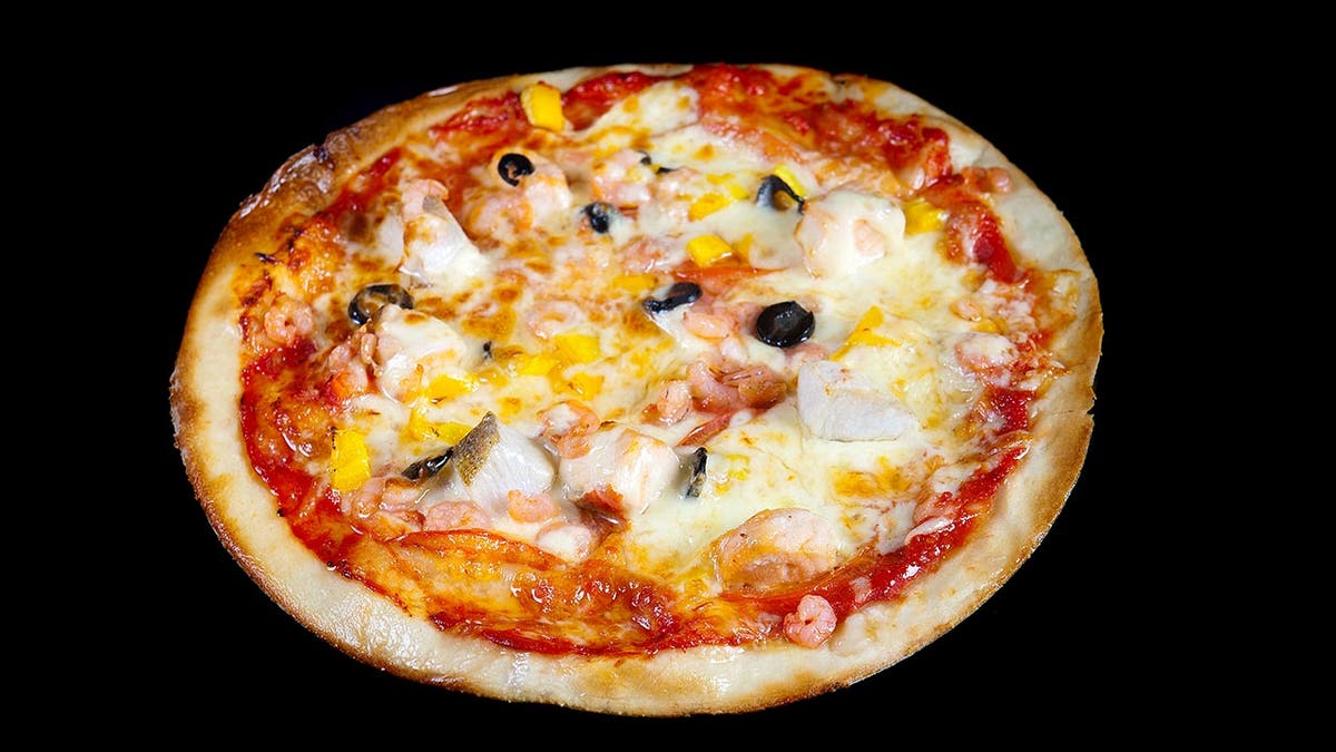 A pizza successful  Moscow is topped with fish