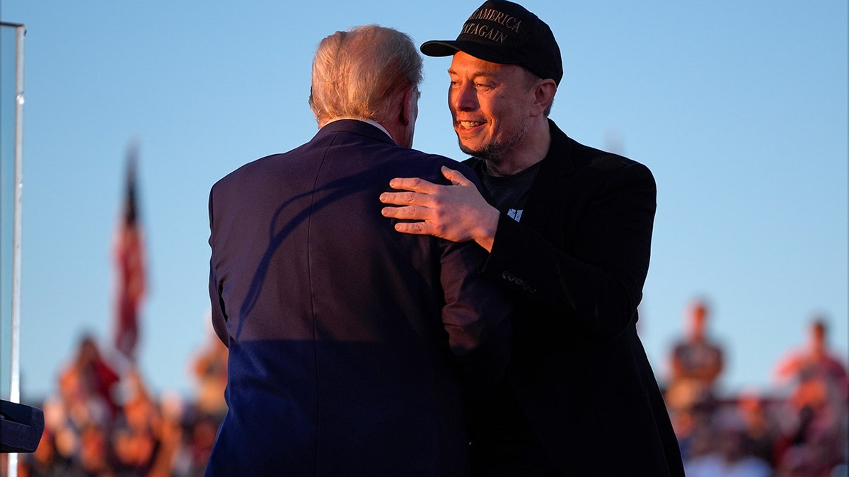 Musk hugs Trump