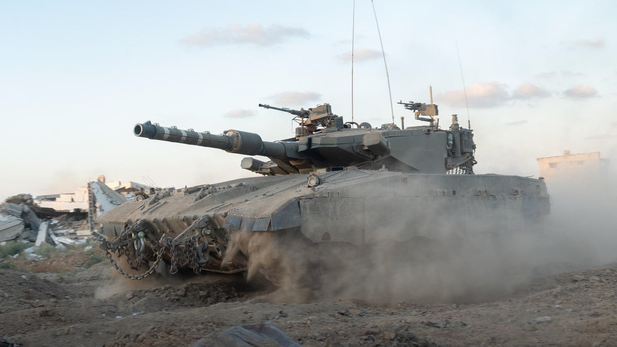 An IDF tank rolls through the Netzarim Corridor in Gaza. (Photo: IDF Spokesman's Unit.)