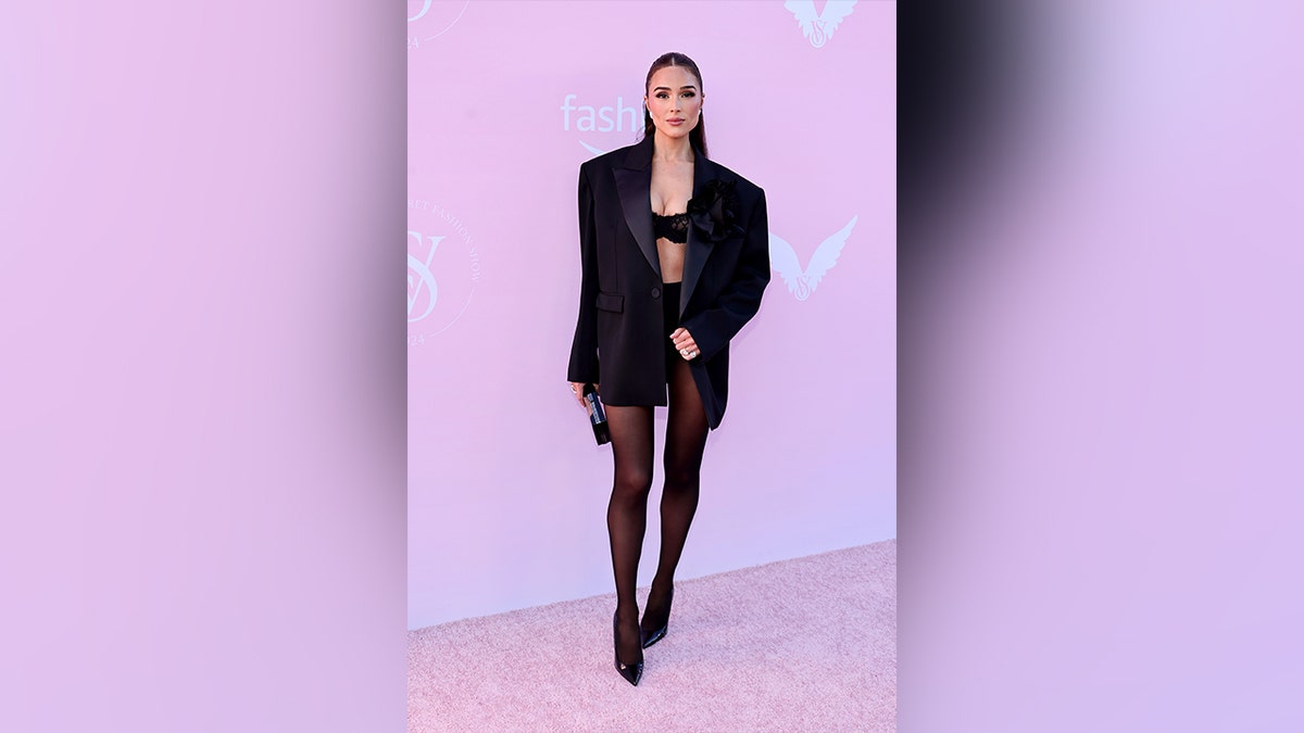 Olivia Culpo wore a black blazer over a bralette and short shorts at the Victoria's Secret Fashion Show.