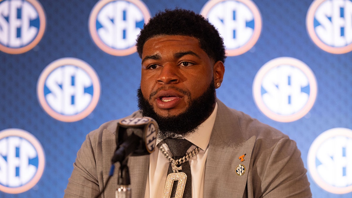 Tennessee player shoves fan storming field to the ground after upset loss to Arkansas  at george magazine