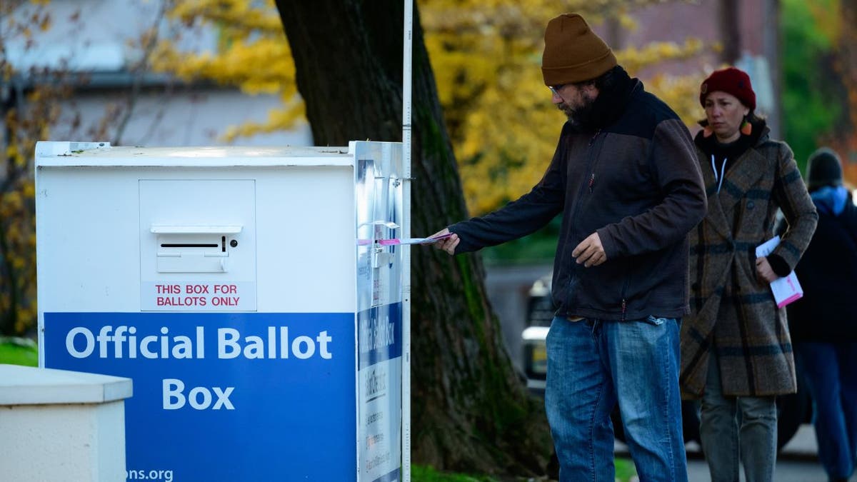 Voters cast their ballots at official ballot boxes in Portland, Oregon on November 8, 2022