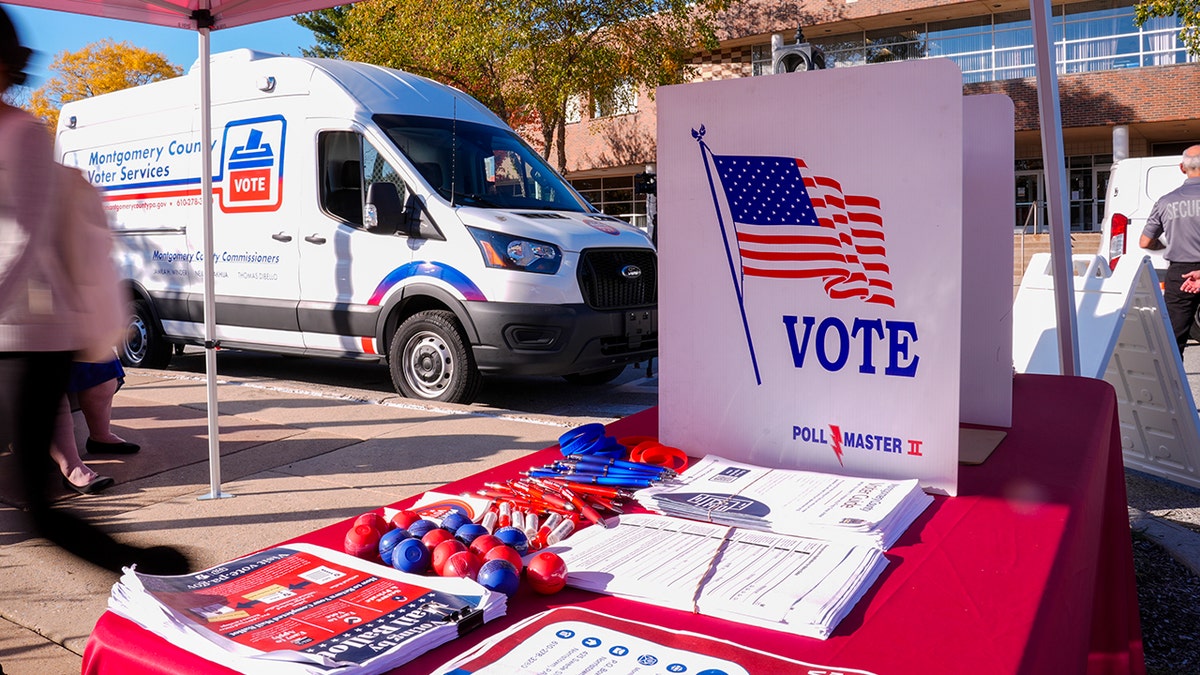 voter array  with elector  van parked nearby