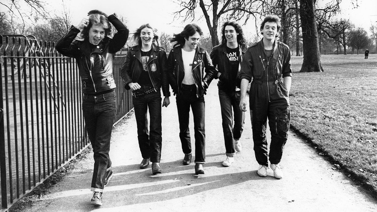 Dennis STRATTON and Steve HARRIS and Paul DI'ANNO and IRON MAIDEN and Dave MURRAY and Clive BURR; LR: Clive Burr, Dave Murray, Steve Harris, Dennis Stratton, Paul Di'Anno - posing, group photo, walking