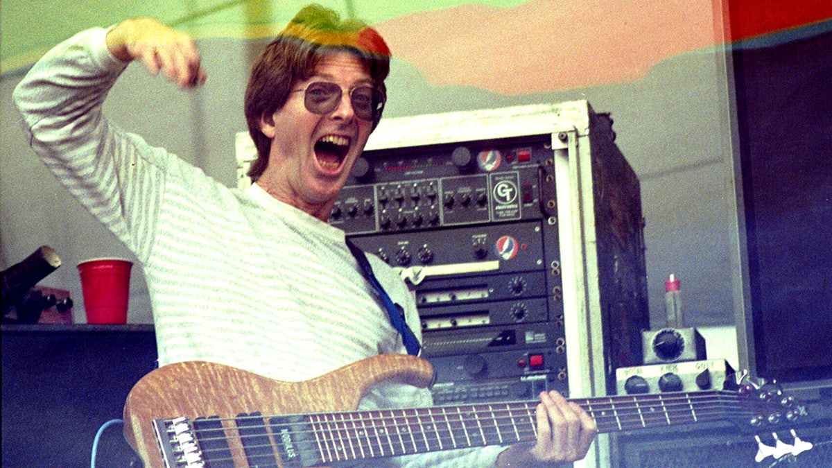 Phil Lesh smiling while on stage in 1990