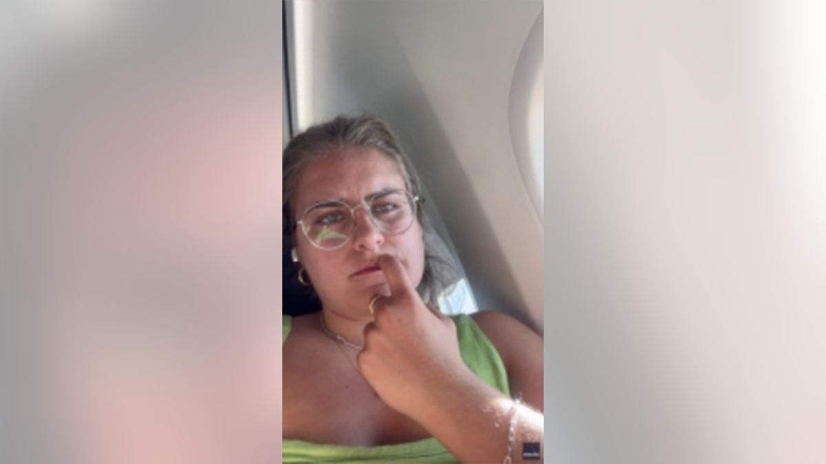 Frustrated traveler on airplane