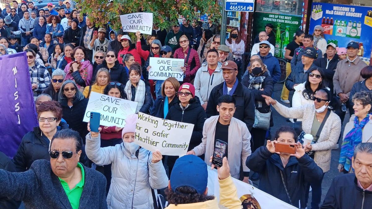 Protesters hold signs against prostitution