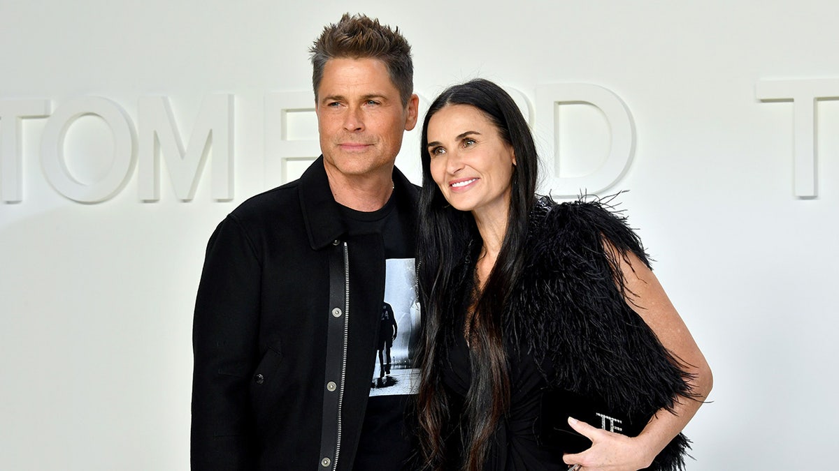 Rob Lowe con Demi Moore en un evento