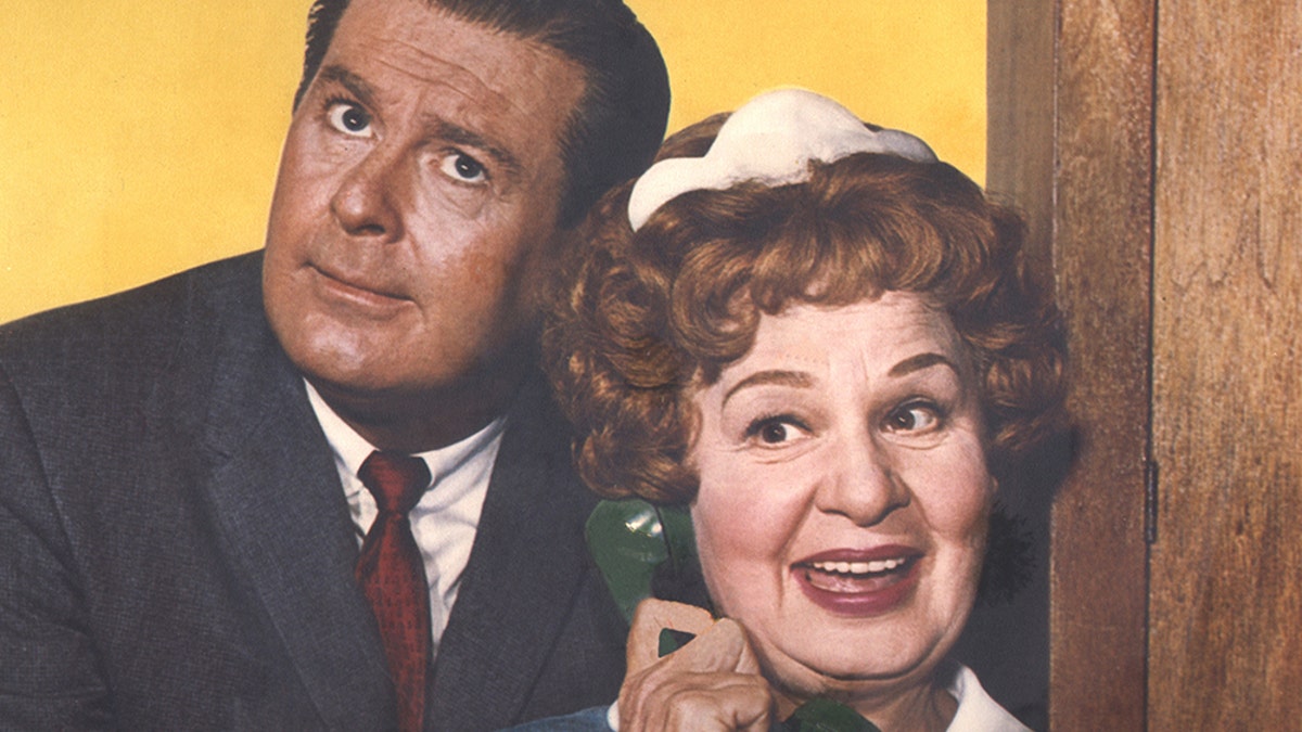 Don DeFore making a funny face next to the character Hazel holding the phone.