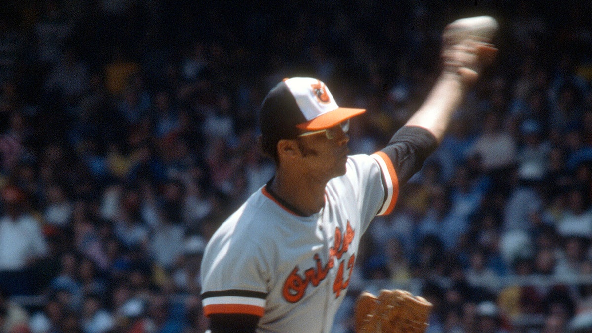 Rudy May throws a pitch