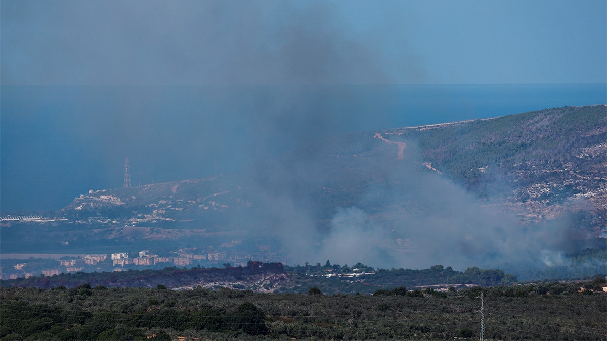 Smoke rises from bluish   Israel